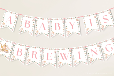 Hanging A Baby Is Brewing baby shower banner with teacups, teapots and flowers.