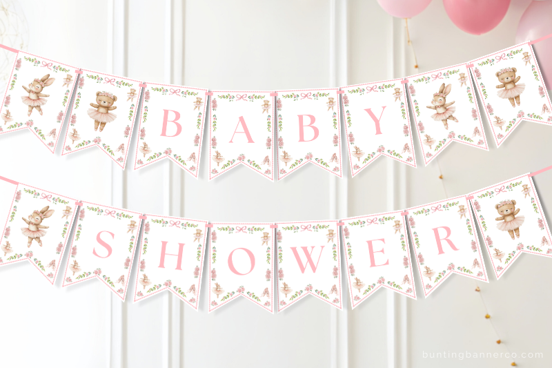 Ballerina baby shower banner on wall with ballerinas, ballet shoes, bows and flowers.