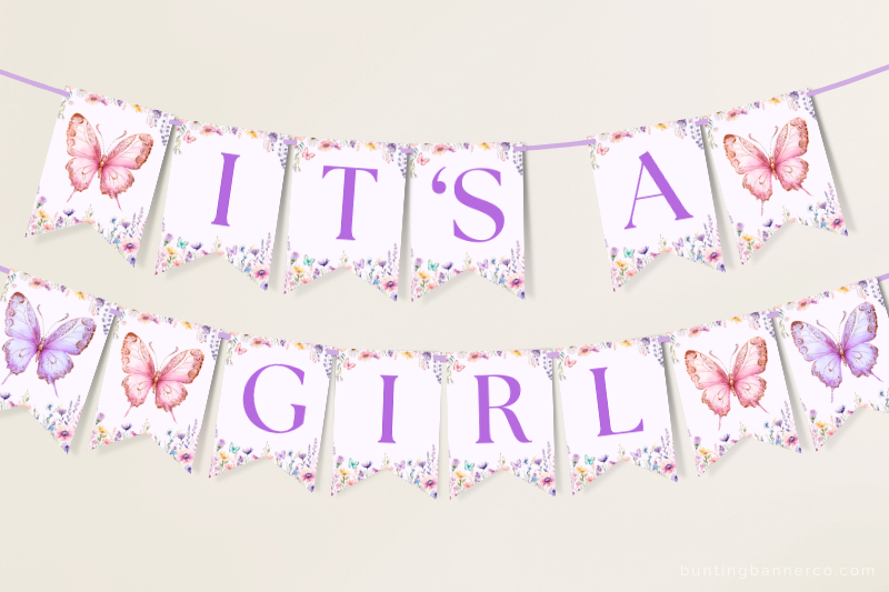 Hanging It's A Girl butterfly baby shower banner with butterflies and wildflowers.