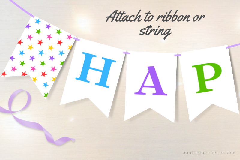 Happy Birthday letter bunting flags with colorful rainbow letters and stars on ribbon.