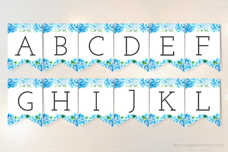 Alphabet bunting flags with black serif font and and blue hydrangea floral border for baby shower banner personalization.