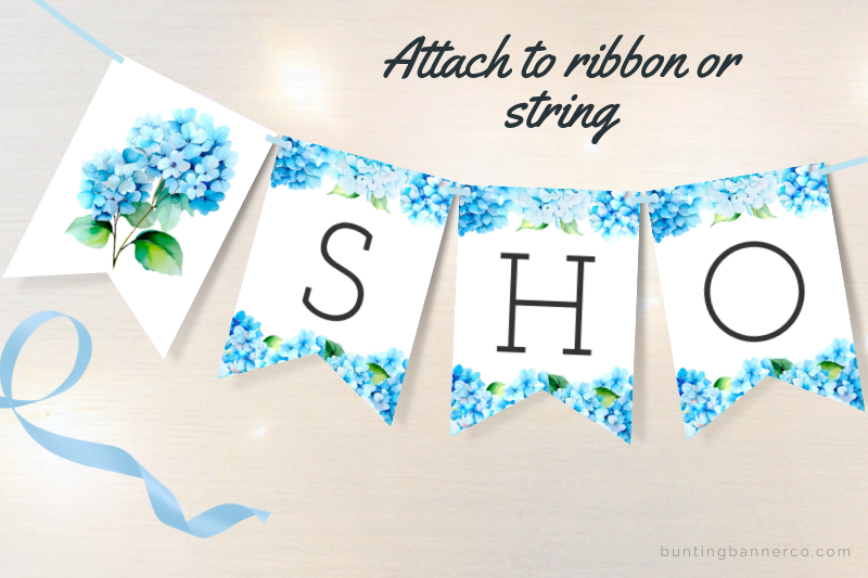 Baby shower bunting flags with blue hydrangea flowers and black letters.