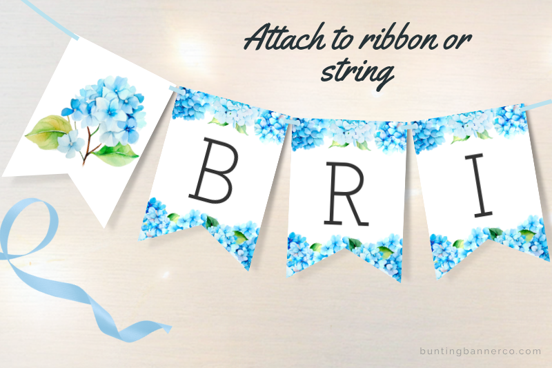 Bridal shower bunting flags with blue hydrangea flowers and black letters.