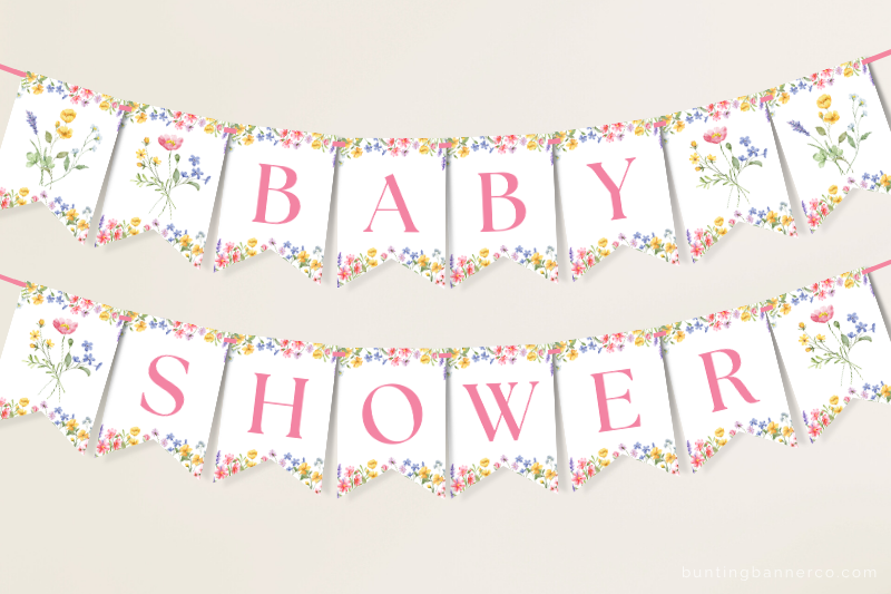 Hanging wildflower baby shower banner with watercolor wildflowers and foliage.