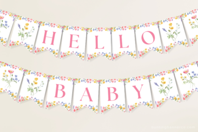 Hanging Hello Baby wildflower baby shower banner with watercolor wildflowers and foliage.