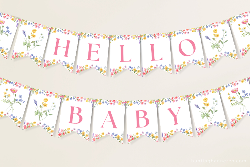 Hanging Hello Baby wildflower baby shower banner with watercolor wildflowers and foliage.