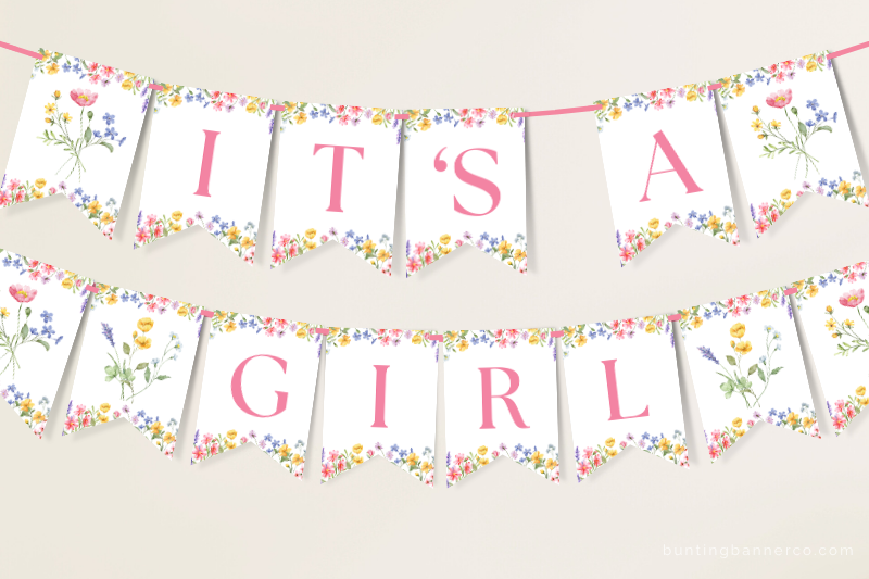 Hanging It's A Girl wildflower baby shower banner with watercolor wildflowers and foliage.
