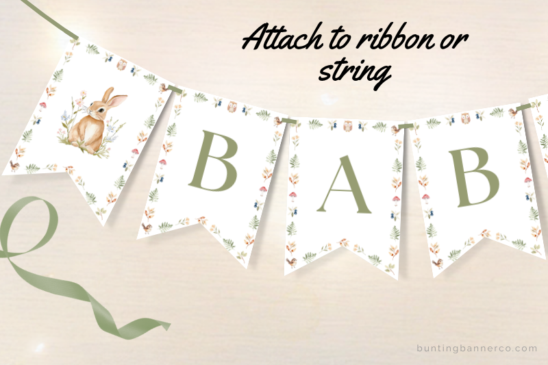 Printable woodland baby shower banner flags with watercolor deer, rabbit and woodland plants.
