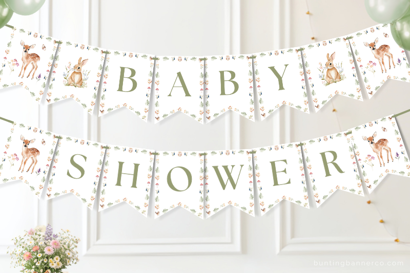 Woodland baby shower banner on a wall with watercolor deer and rabbits.