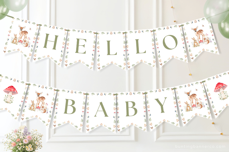 Hello baby Woodland baby shower banner on a wall with watercolor deer, squirrel and rabbit and mushrooms.