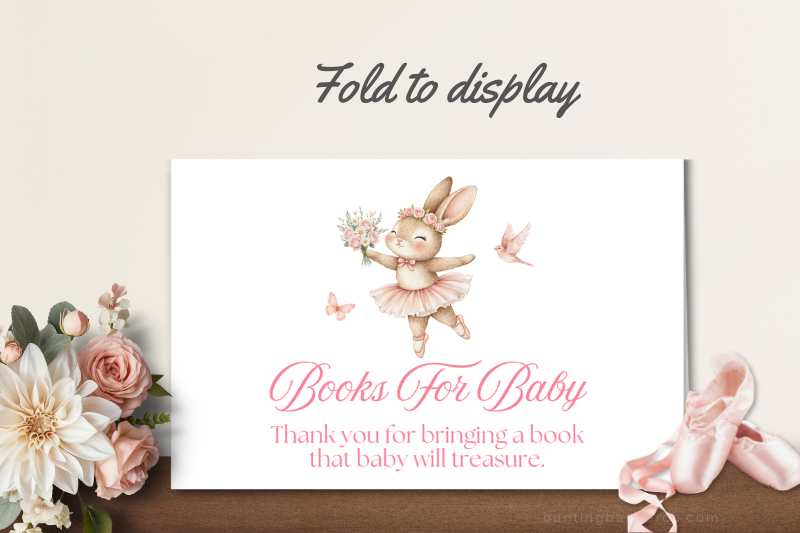 Printable ballerina books for baby sign folded for display at baby shower.