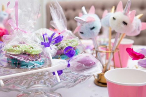Unicorn themed birthday party setting with unicorn decorations.